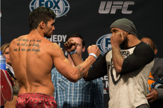 CLARKSVILLE, TN - NOVEMBER 5: Ronny Markes (L) and Yoel Romero (R) face off during the UFC Fight For the Troops weigh-in at the Fort Campbell Sabre Air Field hanger on November 5, 2013 in Clarksville, Tennessee. (Photo by Ed Mulholland/Zuffa LLC/Zuffa LL