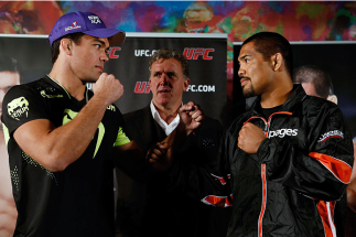 MANCHESTER, ENGLAND - OCTOBER 23: (L-R) Opponents Lyoto Machida and Mark Munoz face off after the UFC open workouts inside Shooterâs Sports Bar on October 23, 2013 in Manchester, England. (Photo by Josh Hedges/Zuffa LLC/Zuffa LLC via Getty Images)