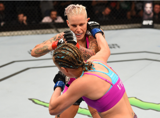 ADELAIDE, AUSTRALIA - MAY 10: (R-L) Lisa Ellis punches Bec Rawlings in their women's strawweight bout during the UFC Fight Night event at the Adelaide Entertainment Centre on May 10, 2015 in Adelaide, Australia. (Photo by Josh Hedges/Zuffa LLC/Zuffa LLC