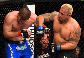 ADELAIDE, AUSTRALIA - MAY 10: (R-L) Mark Hunt punches Stipe Miocic in their heavyweight bout during the UFC Fight Night event at the Adelaide Entertainment Centre on May 10, 2015 in Adelaide, Australia. (Photo by Josh Hedges/Zuffa LLC/Zuffa LLC via Gett