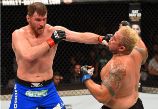 ADELAIDE, AUSTRALIA - MAY 10: (L-R) Stipe Miocic punches Mark Hunt in their heavyweight bout during the UFC Fight Night event at the Adelaide Entertainment Centre on May 10, 2015 in Adelaide, Australia. (Photo by Josh Hedges/Zuffa LLC/Zuffa LLC via Gett
