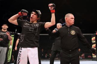 EAST RUTHERFORD, NJ - MAY 05: Roland Delorme (L) celebrates after defeating Nick Denis in thier Bantamweight bout at Izod Center on May 5, 2012 in East Rutherford, New Jersey. (Photo by Josh Hedges/Zuffa LLC/Zuffa LLC via Getty Images)