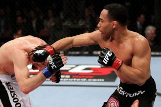 EAST RUTHERFORD, NJ - MAY 05: John Dodson (R) punches Timothy Elliott (L) during thier Flyweight bout at Izod Center on May 5, 2012 in East Rutherford, New Jersey. (Photo by Josh Hedges/Zuffa LLC/Zuffa LLC via Getty Images)