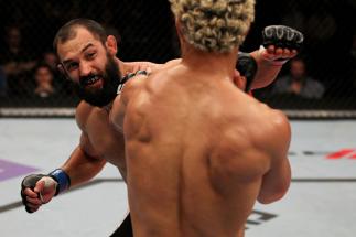 EAST RUTHERFORD, NJ - MAY 05: Johny Hendricks (L) punches Josh Koscheck (R) during thier Welterweight bout at Izod Center on May 5, 2012 in East Rutherford, New Jersey. (Photo by Josh Hedges/Zuffa LLC/Zuffa LLC via Getty Images)