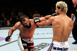 EAST RUTHERFORD, NJ - MAY 05: Johny Hendricks (L) punches Josh Koscheck (R) during thier Welterweight bout at Izod Center on May 5, 2012 in East Rutherford, New Jersey. (Photo by Josh Hedges/Zuffa LLC/Zuffa LLC via Getty Images)