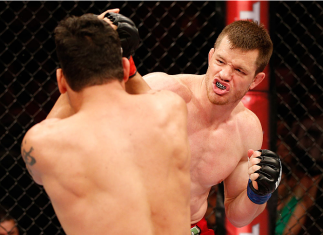 NATAL, BRAZIL - MARCH 23: (R-L) CB Dollaway punches Cezar "Mutante" Ferreira in their middleweight bout during the UFC Fight Night event at Ginasio Nelio Dias on March 23, 2014 in Natal, Brazil. (Photo by Josh Hedges/Zuffa LLC/Zuffa LLC via Getty Images)