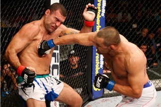 NATAL, BRAZIL - MARCH 23: (R-L) Dan Henderson punches Mauricio "Shogun" Rua in their light heavyweight bout during the UFC Fight Night event at Ginasio Nelio Dias on March 23, 2014 in Natal, Brazil. (Photo by Josh Hedges/Zuffa LLC/Zuffa LLC via Getty Ima