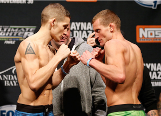 LAS VEGAS, NV - NOVEMBER 29: (L-R) Opponents Chris Holdsworth and David "Davey" Grant face off during the weigh-in for The Ultimate Fighter season 18 live finale inside the Mandalay Bay Events Center on November 29, 2013 in Las Vegas, Nevada. (Photo by J