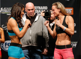 LAS VEGAS, NV - NOVEMBER 29: (L-R) Opponents Julianna Pena and Jessica Rakoczy face off during the weigh-in for The Ultimate Fighter season 18 live finale inside the Mandalay Bay Events Center on November 29, 2013 in Las Vegas, Nevada. (Photo by Josh Hed