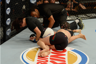 LAS VEGAS, NV - JULY 12: (L-R) Michelle Waterson attempts to submit Michelle Waterson in their women's strawweight bout during the Ultimate Fighter Finale inside MGM Grand Garden Arena on July 12, 2015 in Las Vegas, Nevada. (Photo by Brandon Magnus/Zuff