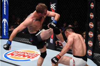 LAS VEGAS, NV - DECEMBER 11: (L-R) Jason Knight kicks Tatsuya Kawajiri in their featherweight bout during the TUF Finale event inside The Chelsea at The Cosmopolitan of Las Vegas on December 11, 2015 in Las Vegas, Nevada. (Photo by Jeff Bottari/Zuffa LLC
