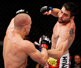 MONTREAL, QC - NOVEMBER 17: Carlos Condit (L) fights against Georges St-Pierre in their welterweight title bout during UFC 154 on November 17, 2012 at the Bell Centre in Montreal, Canada. (Photo by Josh Hedges/Zuffa LLC/Zuffa LLC via Getty Images)