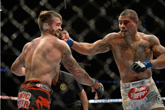 NEWARK, NJ - FEBRUARY 1:  (R-L) Abel Trujillo connects with a punch to the chin of Jamie Varner in their lightweight fight during the UFC 169 event at the Prudential Center on January 31, 2014 in Newark, New Jersey. (Photo by Jeff Bottari/Zuffa LLC/Zuffa 