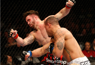NEWARK, NJ - FEBRUARY 01: (R-L) Abel Trujillo knocks out Jamie Varner with a punch in their lightweight fight at the UFC 169 event inside the Prudential Center on February 1, 2014 in Newark, New Jersey. (Photo by Josh Hedges/Zuffa LLC/Zuffa LLC via Getty