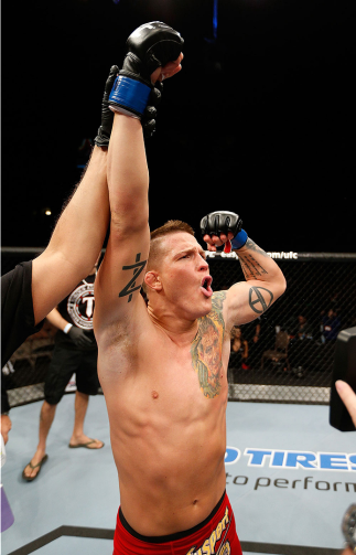 LAS VEGAS, NV - FEBRUARY 22: Erik Koch reacts to being declared the winner over Rafaello Oliveira in their lightweight bout during UFC 170 inside the Mandalay Bay Events Center on February 22, 2014 in Las Vegas, Nevada. (Photo by Josh Hedges/Zuffa LLC/Zu