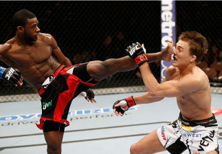 LAS VEGAS, NV - FEBRUARY 22: (L-R) Aljamain Sterling kicks Cody Gibson in their bantamweight bout during UFC 170 inside the Mandalay Bay Events Center on February 22, 2014 in Las Vegas, Nevada. (Photo by Josh Hedges/Zuffa LLC/Zuffa LLC via Getty Images)