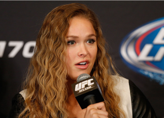 LAS VEGAS, NV - FEBRUARY 20: Ronda Rousey interacts with media during the final UFC 170 pre-fight press conference at the Mandalay Bay Resort and Casino on February 20, 2014 in Las Vegas, Nevada. (Photo by Josh Hedges/Zuffa LLC/Zuffa LLC via Getty Images