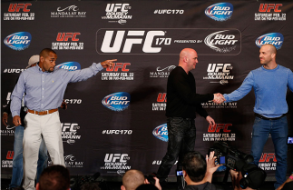 LAS VEGAS, NV - FEBRUARY 20: Opponents Daniel Cormier (L) and Patrick Cummins (R) are separated by UFC President Dana White after a heated exchange during the final UFC 170 pre-fight press conference at the Mandalay Bay Resort and Casino on February 20,
