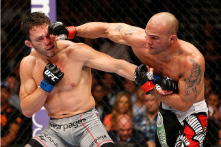 LAS VEGAS, NV - MAY 24: (R-L) Robbie Lawler punches Jake Ellenberger in their welterweight bout during the UFC 173 event at the MGM Grand Garden Arena on May 24, 2014 in Las Vegas, Nevada. (Photo by Josh Hedges/Zuffa LLC/Zuffa LLC via Getty Images)