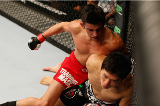 LAS VEGAS, NV - SEPTEMBER 27:  (L-R) Dominick Cruz punches Takeya Mizugaki in their bantamweight fight during the UFC 178 event inside the MGM Grand Garden Arena on September 27, 2014 in Las Vegas, Nevada.  (Photo by Josh Hedges/Zuffa LLC/Zuffa LLC via Ge