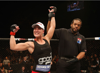 MEXICO CITY, MEXICO - NOVEMBER 15: Jessica Eye celebrates her victory over Leslie Smith in their women's bantamweight bout during the UFC 180 event at Arena Ciudad de Mexico on November 15, 2014 in Mexico City, Mexico. (Photo by Josh Hedges/Zuffa LLC/Zu