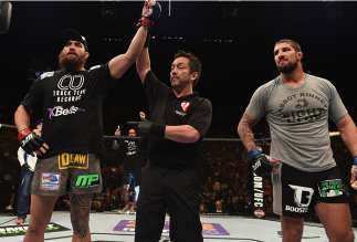 LAS VEGAS, NV - DECEMBER 06: Travis Browne (left) is declared the winner over Brendan Schaub (right) in their heavyweight bout during the UFC 181 event inside the Mandalay Bay Events Center on December 6, 2014 in Las Vegas, Nevada. (Photo by Robert Labe