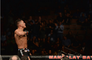 LAS VEGAS, NV - DECEMBER 06: Anthony Pettis reacts to his victory over Gilbert Melendez in their UFC lightweight championship bout during the UFC 181 event inside the Mandalay Bay Events Center on December 6, 2014 in Las Vegas, Nevada. (Photo by Robert