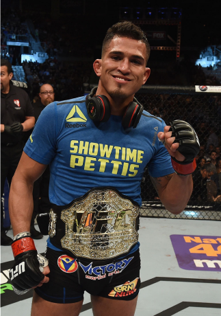 LAS VEGAS, NV - DECEMBER 06: Anthony Pettis reacts to his victory over Gilbert Melendez in their UFC lightweight championship bout during the UFC 181 event inside the Mandalay Bay Events Center on December 6, 2014 in Las Vegas, Nevada. (Photo by Robert