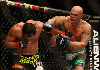 LAS VEGAS, NV - DECEMBER 06: (R-L) Robbie Lawler punches Johny Hendricks in their UFC welterweight championship bout during the UFC 181 event inside the Mandalay Bay Events Center on December 6, 2014 in Las Vegas, Nevada. (Photo by Josh Hedges/Zuffa LLC