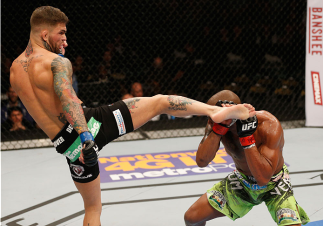 LAS VEGAS, NV - JANUARY 03: (L-R) Cody Garbrandt kickss Marcus Brimage in their bantamweight bout during the UFC 182 event at the MGM Grand Garden Arena on January 3, 2015 in Las Vegas, Nevada. (Photo by Josh Hedges/Zuffa LLC/Zuffa LLC via Getty Images)