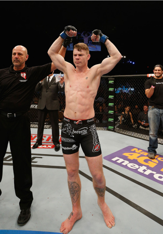 LAS VEGAS, NV - JANUARY 03: Paul Felder celebrates his win over Danny Castillo in their lightweight bout during the UFC 182 event at the MGM Grand Garden Arena on January 3, 2015 in Las Vegas, Nevada. (Photo by Josh Hedges/Zuffa LLC/Zuffa LLC via Getty