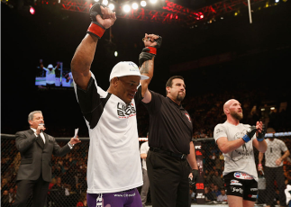 LAS VEGAS, NV - JANUARY 03: (L-R) Hector Lombard celebrates his victory over Josh Burkman in their welterweight bout during the UFC 182 event on at the MGM Grand Garden Arena January 3, 2015 in Las Vegas, Nevada. (Photo by Josh Hedges/Zuffa LLC/Zuffa LL