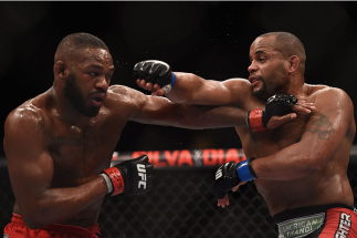 LAS VEGAS, NV - JANUARY 03: Jon Jones (L) and Daniel Cormier (R) exchange punches in their UFC light heavyweight championship bout during the UFC 182 event at the MGM Grand Garden Arena on January 3, 2015 in Las Vegas, Nevada. (Photo by Jeff Bottari/Zuf