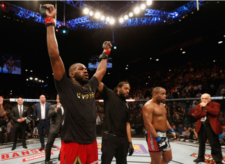 LAS VEGAS, NV - JANUARY 03: UFC light heavyweight champion Jon Jones (L) celebrates his win over Daniel Cormier (R) in their UFC light heavyweight championship bout during the UFC 182 event at the MGM Grand Garden Arena on January 3, 2015 in Las Vegas, N