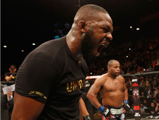 LAS VEGAS, NV - JANUARY 03: UFC light heavyweight champion Jon Jones (L) celebrates his win over Daniel Cormier (R) in their UFC light heavyweight championship bout during the UFC 182 event at the MGM Grand Garden Arena on January 3, 2015 in Las Vegas, N