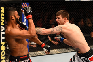 LOS ANGELES, CA - FEBRUARY 28: (R) Tim Means punches Dhiego Lima in their welterweight bout during the UFC 184 event at Staples Center on February 28, 2015 in Los Angeles, California. (Photo by Josh Hedges/Zuffa LLC/Zuffa LLC via Getty Images)