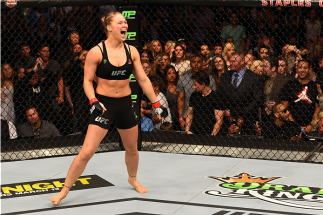 LOS ANGELES, CA - FEBRUARY 28: Ronda Rousey celebrates her victory over Cat Zingano in their UFC women's bantamweight championship bout during the UFC 184 event at Staples Center on February 28, 2015 in Los Angeles, California. (Photo by Josh Hedges/Zuf