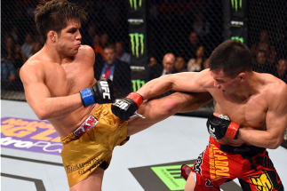DALLAS, TX - MARCH 14: (L-R) Henry Cejudo kicks Chris Cariaso in their flyweight bout during the UFC 185 event at the American Airlines Center on March 14, 2015 in Dallas, Texas. (Photo by Josh Hedges/Zuffa LLC/Zuffa LLC via Getty Images)