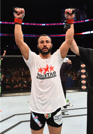 MONTREAL, QC - APRIL 25:   John Makdessi of Canada reacts after his TKO victory over Shane Campbell of the United States in their catchweight bout during the UFC 186 event at the Bell Centre on April 25, 2015 in Montreal, Quebec, Canada. (Photo by Josh He