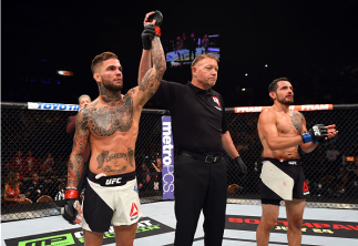 LAS VEGAS, NV - JULY 11: Cody Garbrandt (left) reacts to his victory over Henry Briones (right) in their bantamweight fight during the UFC 189 event inside MGM Grand Garden Arena on July 11, 2015 in Las Vegas, Nevada. (Photo by Josh Hedges/Zuffa LLC/Zuf