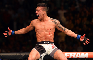 LAS VEGAS, NV - JULY 11: Thomas Almeida celebrates his win over Brad Pickett in their bantamweight fight during the UFC 189 event inside MGM Grand Garden Arena on July 11, 2015 in Las Vegas, Nevada. (Photo by Josh Hedges/Zuffa LLC/Zuffa LLC via Getty Im