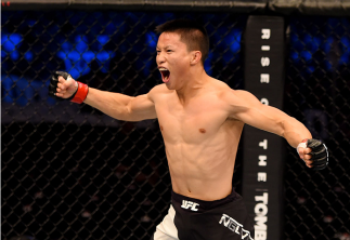 MELBOURNE, AUSTRALIA - NOVEMBER 15: Ben Nguyen celebrates his win by submission due to rear naked choke against Ryan Benoit (not pictured) in their flyweight bout during the UFC 193 event at Etihad Stadium on November 15, 2015 in Melbourne, Australia. (