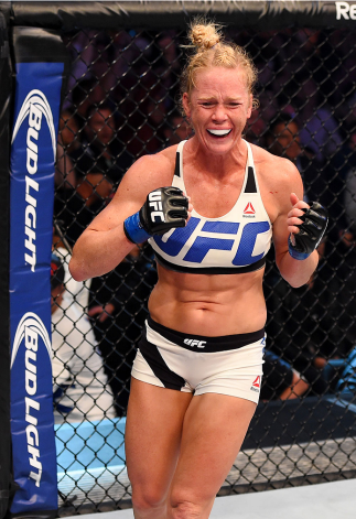 MELBOURNE, AUSTRALIA - NOVEMBER 15:  Holly Holm celebrates her second round KO (headkick and punches) over Ronda Rousey (not pictured) in their UFC women's bantamweight championship bout during the UFC 193 event at Etihad Stadium on November 15, 2015 in M