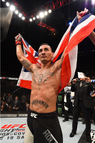 LAS VEGAS, NV - DECEMBER 12: Max Holloway reacts to being declared the winner against Jeremy Stephens in their featherweight bout during the UFC 194 event inside MGM Grand Garden Arena on December 12, 2015 in Las Vegas, Nevada. (Photo by Josh Hedges/Zuff