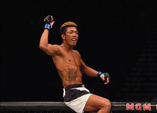 LAS VEGAS, NV - MARCH 05: Teruto Ishihara of Japan reacts to his victory over Julian Erosa in their featherweight bout during the UFC 196 event inside MGM Grand Garden Arena on March 5, 2016 in Las Vegas, Nevada. (Photo by Josh Hedges/Zuffa LLC/Zuffa LL