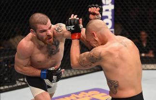 LAS VEGAS, NV - MARCH 05: (L-R) Jim Miller punches Diego Sanchez in their lightweight bout during the UFC 196 event inside MGM Grand Garden Arena on March 5, 2016 in Las Vegas, Nevada. (Photo by Josh Hedges/Zuffa LLC/Zuffa LLC via Getty Images) *** Local