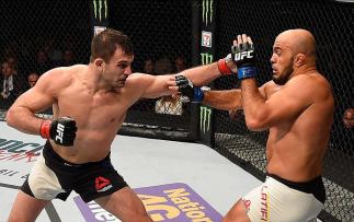 LAS VEGAS, NV - MARCH 05: (L) Gian Villante punches Ilir Latifi in their light heavyweight bout during the UFC 196 event inside MGM Grand Garden Arena on March 5, 2016 in Las Vegas, Nevada. (Photo by Josh Hedges/Zuffa LLC/Zuffa LLC via Getty Images) ***