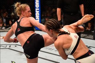 LAS VEGAS, NV - MARCH 05: (L-R) Holly Holm kicks Miesha Tate in their UFC women's bantamweight championship bout during the UFC 196 event inside MGM Grand Garden Arena on March 5, 2016 in Las Vegas, Nevada. (Photo by Josh Hedges/Zuffa LLC/Zuffa LLC via G