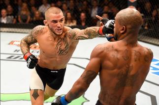 INGLEWOOD, CA - JUNE 04: Dustin Poirier punches Bobby Green in their lightweight bout during the UFC 199 event at The Forum on June 4, 2016 in Inglewood, California. (Photo by Josh Hedges/Zuffa LLC/Zuffa LLC via Getty Images)