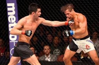 INGLEWOOD, CA - JUNE 04: Dominick Cruz throws a left punch at Urijah Faber in their UFC bantamweight championship bout during the UFC 199 event at The Forum on June 4, 2016 in Inglewood, California. (Photo by Josh Hedges/Zuffa LLC/Zuffa LLC via Getty Ima